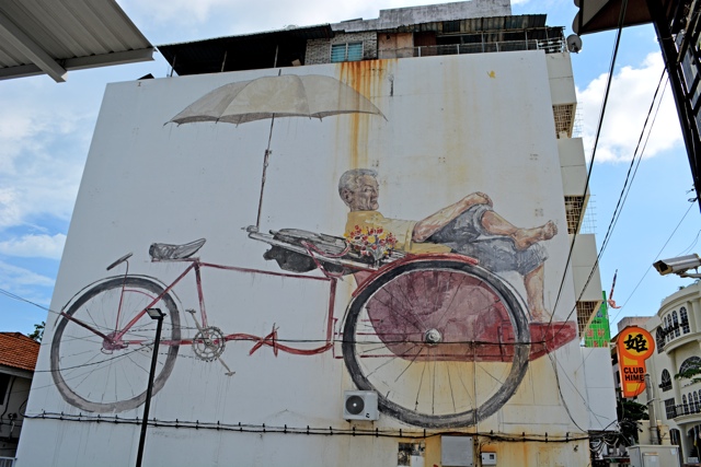 the-awaiting-trishaw-and-paddler-rickshaw-The-Street-Art-of-George-Town-Penang-Malaysia